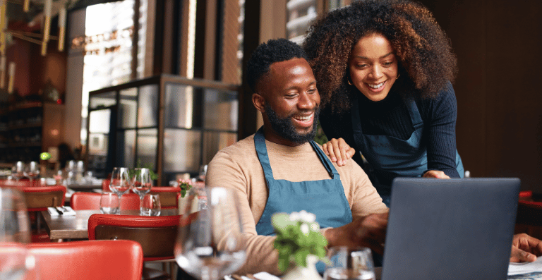 Black couple operating restaurant business